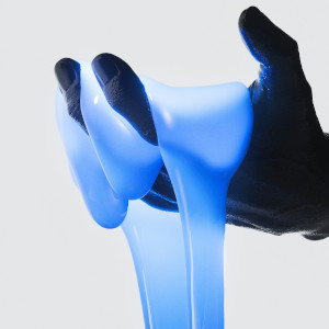 Hand with blue liquid running through it